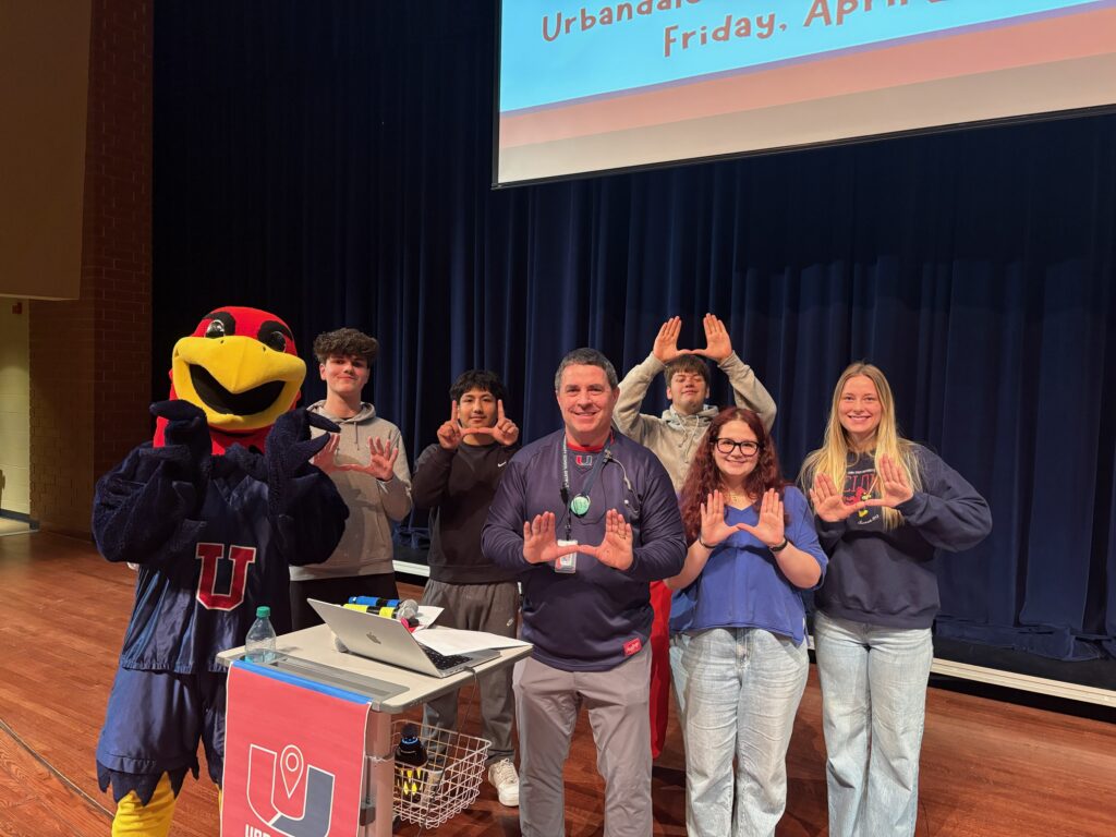 Urbandale Career Con 2025 Student leaders posing for a picture with the school mascot.