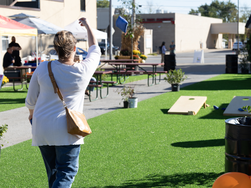 Woman playing bags at the pop up park