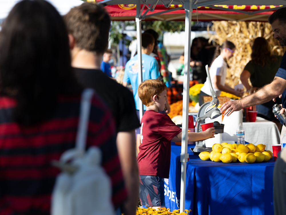 Young boy getting lemonade at the Downtown Urbandale Block Party