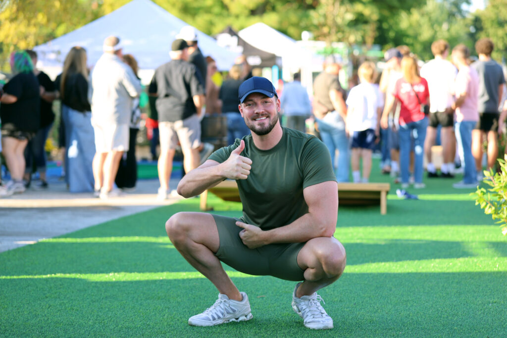 Man posing with a thumbs up at the Downtown Urbandale Block Party
