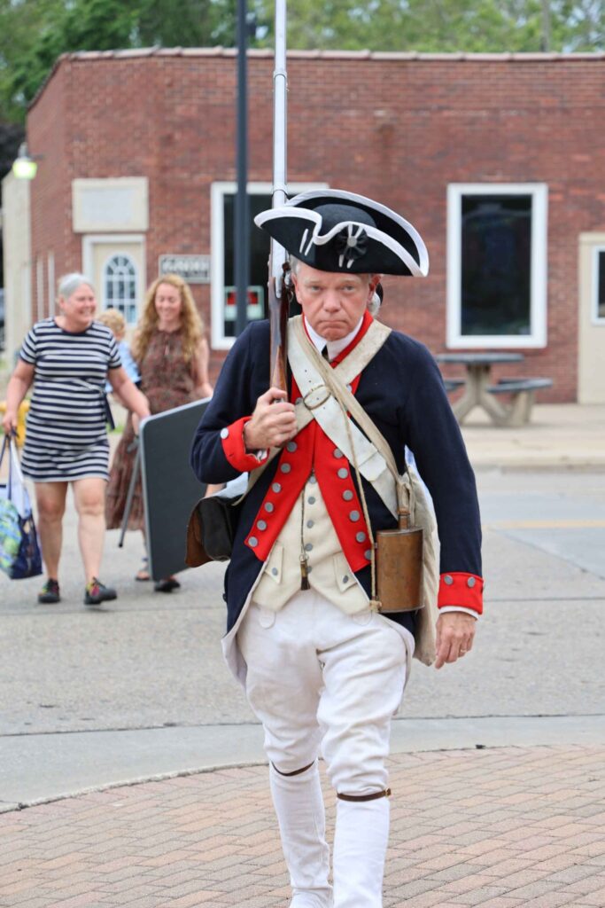 mural-ribbon-cutting-revolutionary-war-reenactor-marching